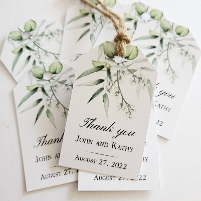 XOXOKristen Eucalyptus Branch Thank You Tags printed with watercolor eucalyptus leaves and delicate greenery, featuring the static “Thank you” text in elegant black script on matte white cardstock.