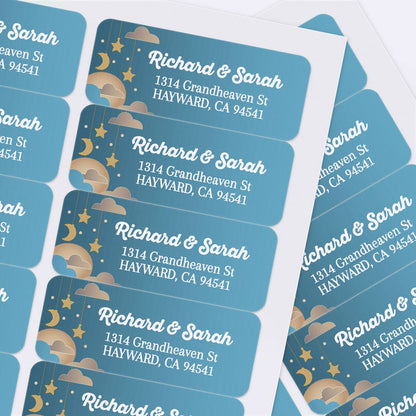 Sheet of custom printed address labels with teal blue background, hanging stars, moon, clouds, and bold white text for mailing - XOXOKristen