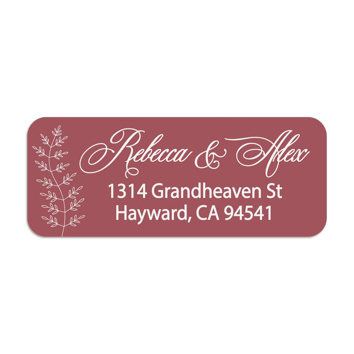 Close-up of burgundy return address sticker with graceful white calligraphy script and botanical branch motif, printed on rectangular label - XOXOKristen