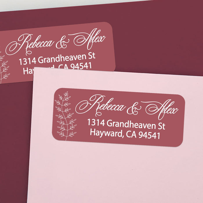 Custom return address labels on pink and burgundy envelopes, featuring burgundy background with floral vine accents and elegant white text - XOXOKristen