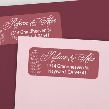 Custom return address labels on pink and burgundy envelopes, featuring burgundy background with floral vine accents and elegant white text - XOXOKristen