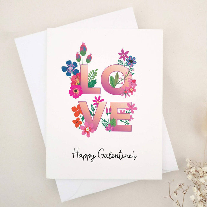 Galentine’s Day card with floral LOVE design and white envelope – XOXOKristen