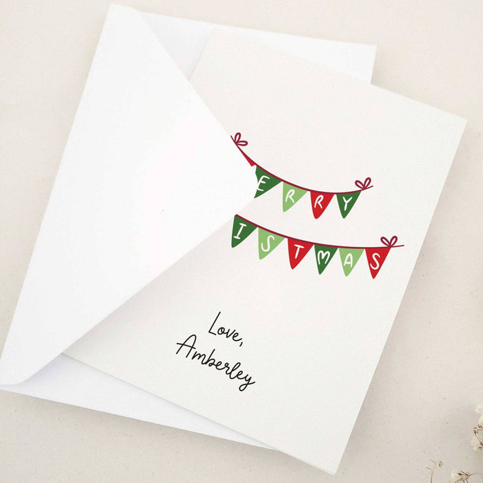 Festive Christmas card featuring Merry Christmas bunting design, opened with blank inside – XOXOKristen