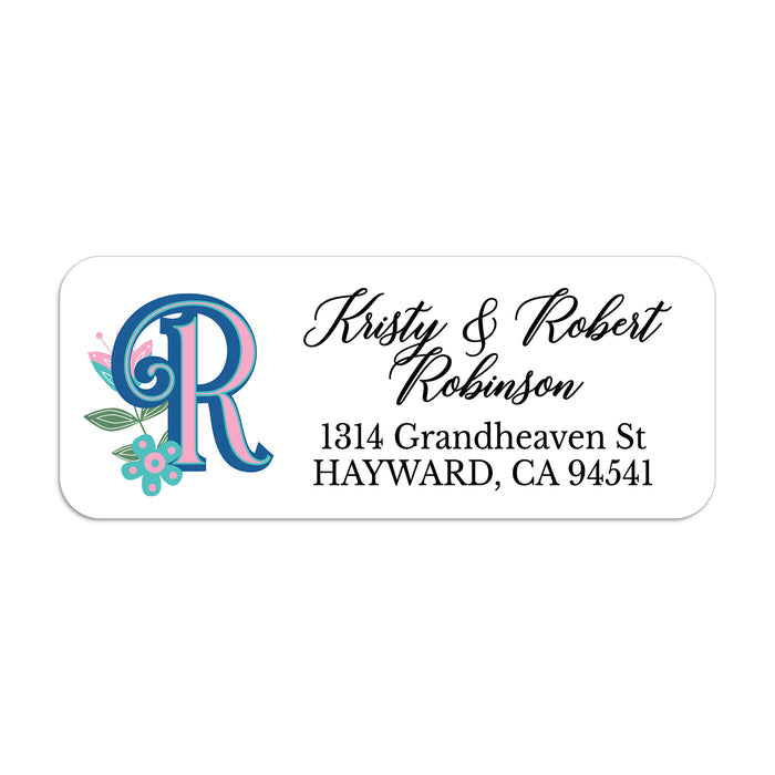 Personalized return address label with bold blue and pink custom monogram and teal floral accents on white background - XOXOKristen