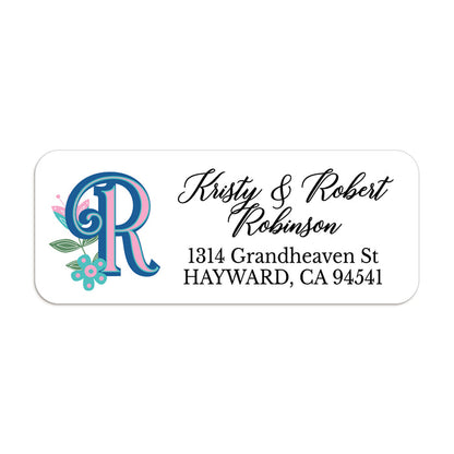 Personalized return address label with bold blue and pink custom monogram and teal floral accents on white background - XOXOKristen