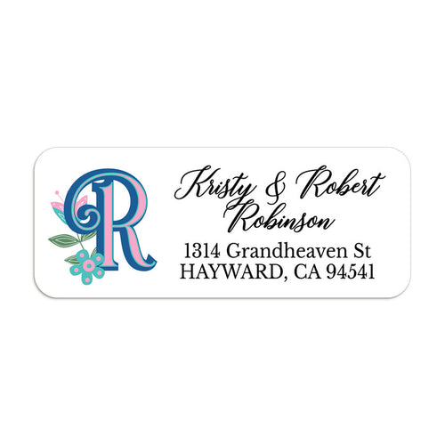 Personalized return address label with bold blue and pink custom monogram and teal floral accents on white background - XOXOKristen
