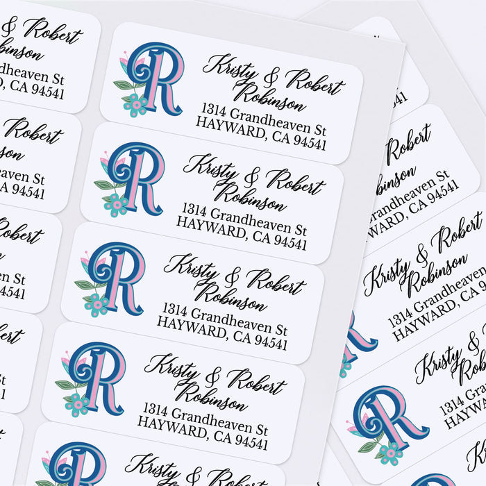 Custom floral monogram address label with decorative custom initial, leaves, and pink flower on white adhesive paper - XOXOKristen