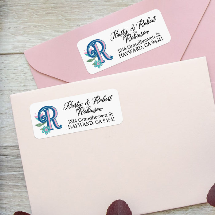 Sheet of custom return address labels with blue and pink monogram and floral design, adhesive peel-and-stick - XOXOKristen